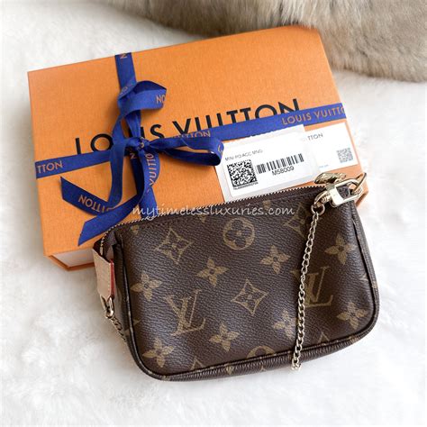 mini pochette louis vuitton evasion|louis vuitton pochette monogram.